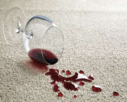 Wine stained carpet in need of carpet cleaning