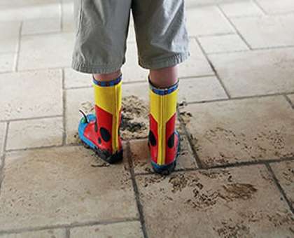 Muddy footprints an a tile floor